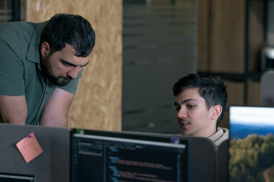 team discussing code