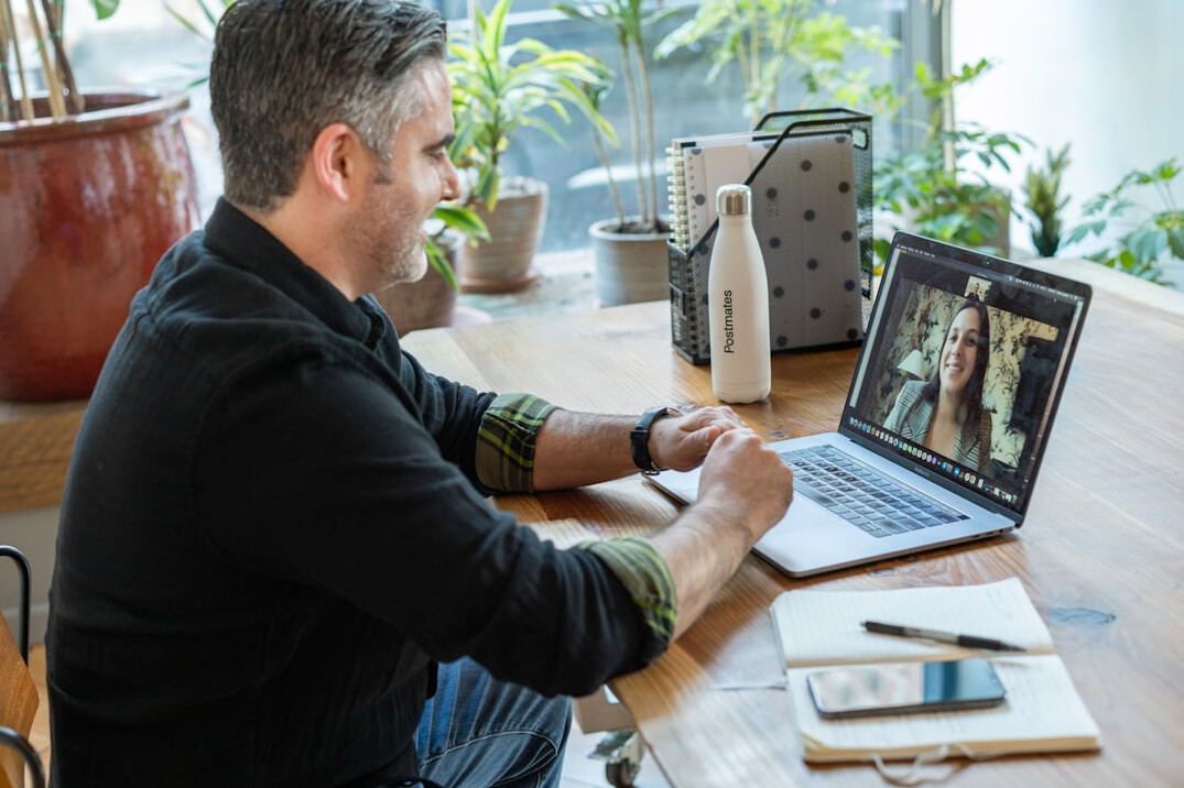 person working remotely on laptop