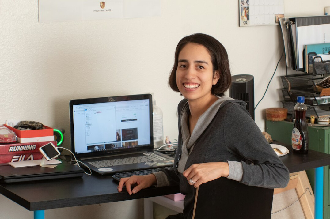 woman coding at desk